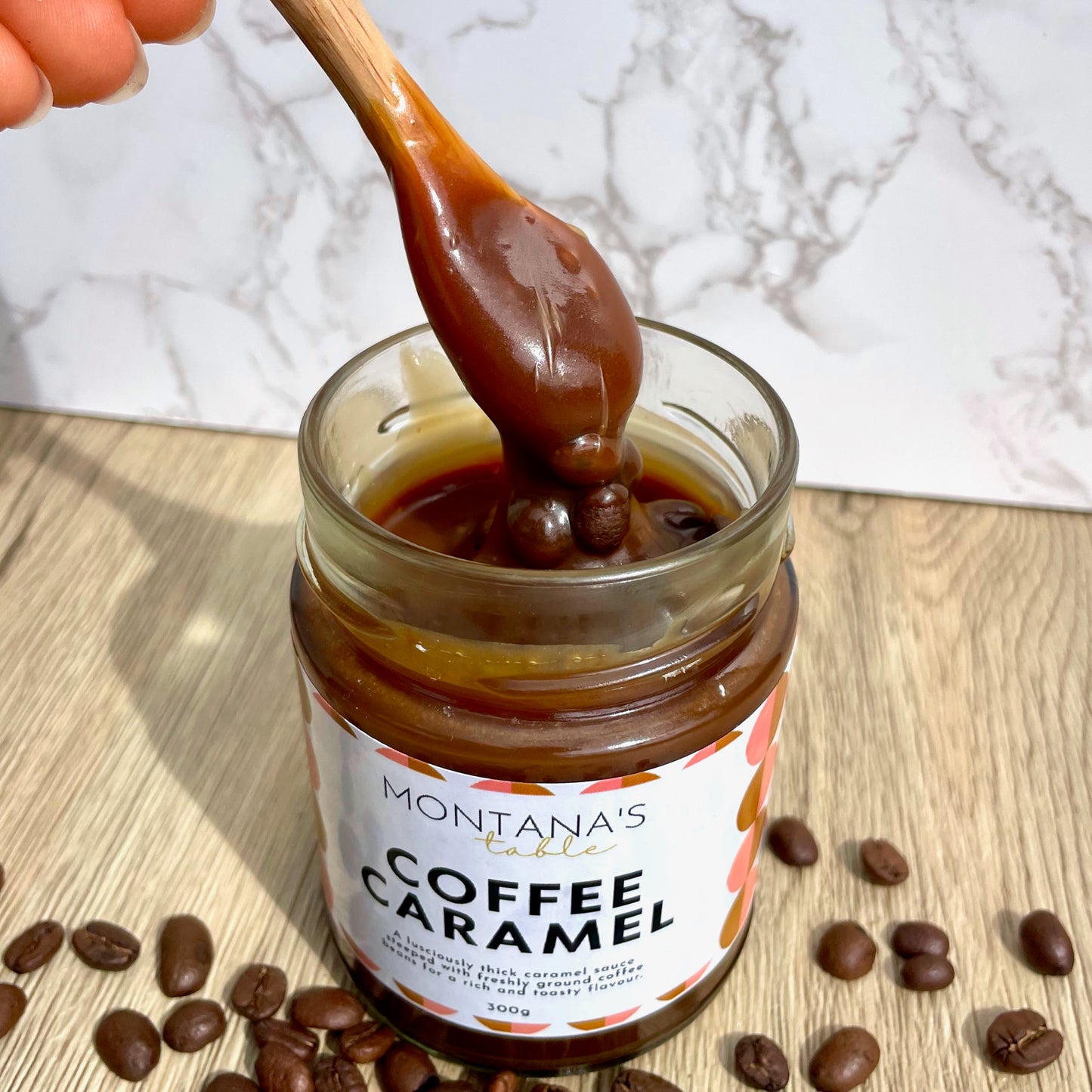 Coffee Caramel Sauce drizzling from a spoon, Montana's Table