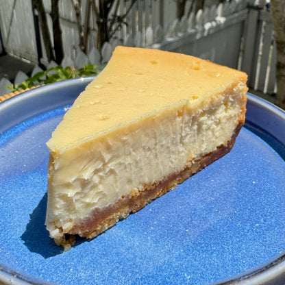 Close-up of Montana's Table baked cheesecake showing biscuit base
