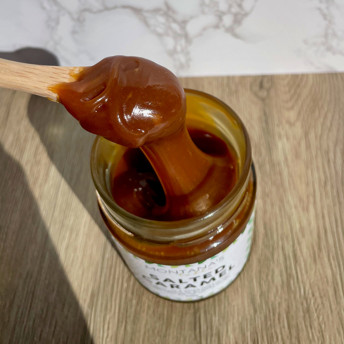 Spoonful of rich Salted Caramel Sauce, Montana's Table